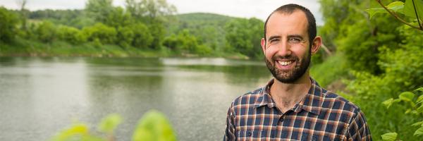 Photo: UVM Jesse Gourevitch near a pond